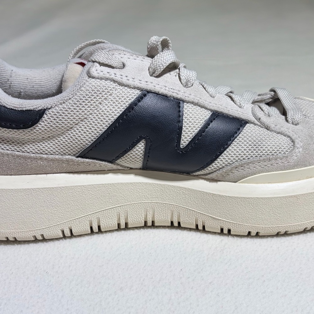 New Balance Beige and Navy Low-Top Sneakers